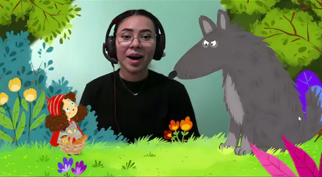 Low-resolution video frame showing a person with headphones in front of a stylized animated forest scene with a child and a large wolf.